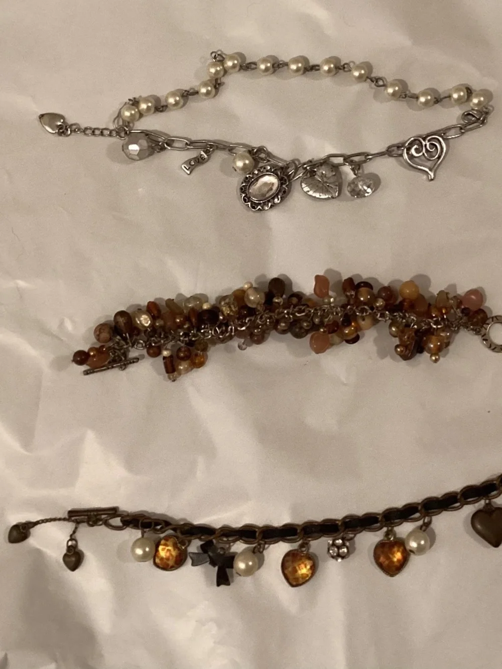 Three charm bead bracelets